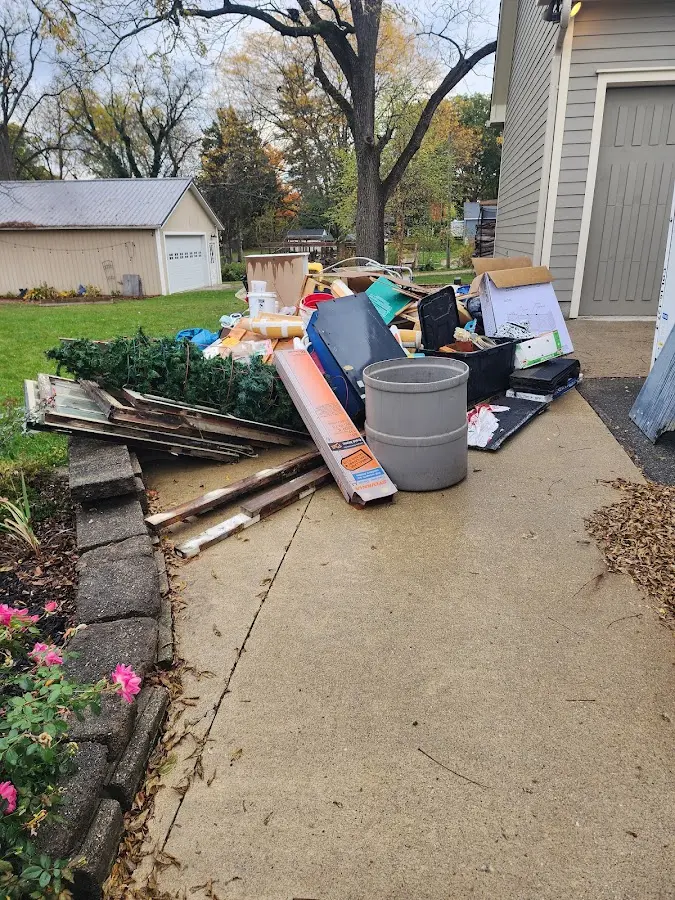 Dumpster being loaded with debris for 12 Yard Dumpster Rental in Lehighton